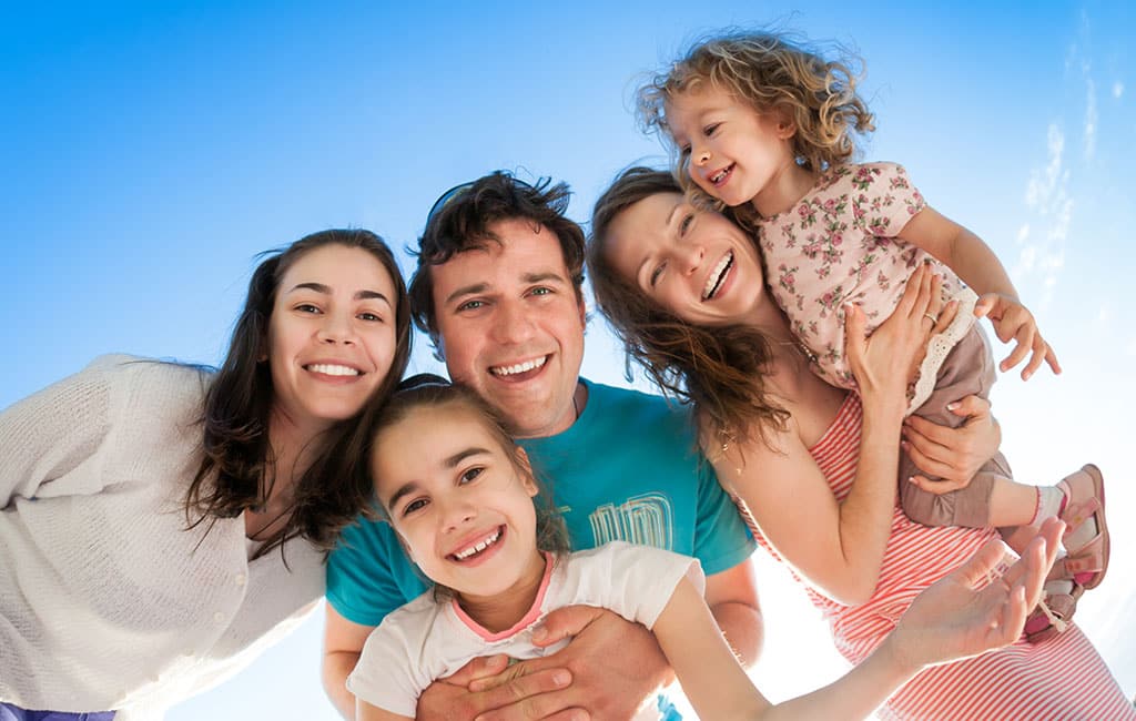 Family with beautiful smiles from  Evergreen Dental in Palmer Alaska.