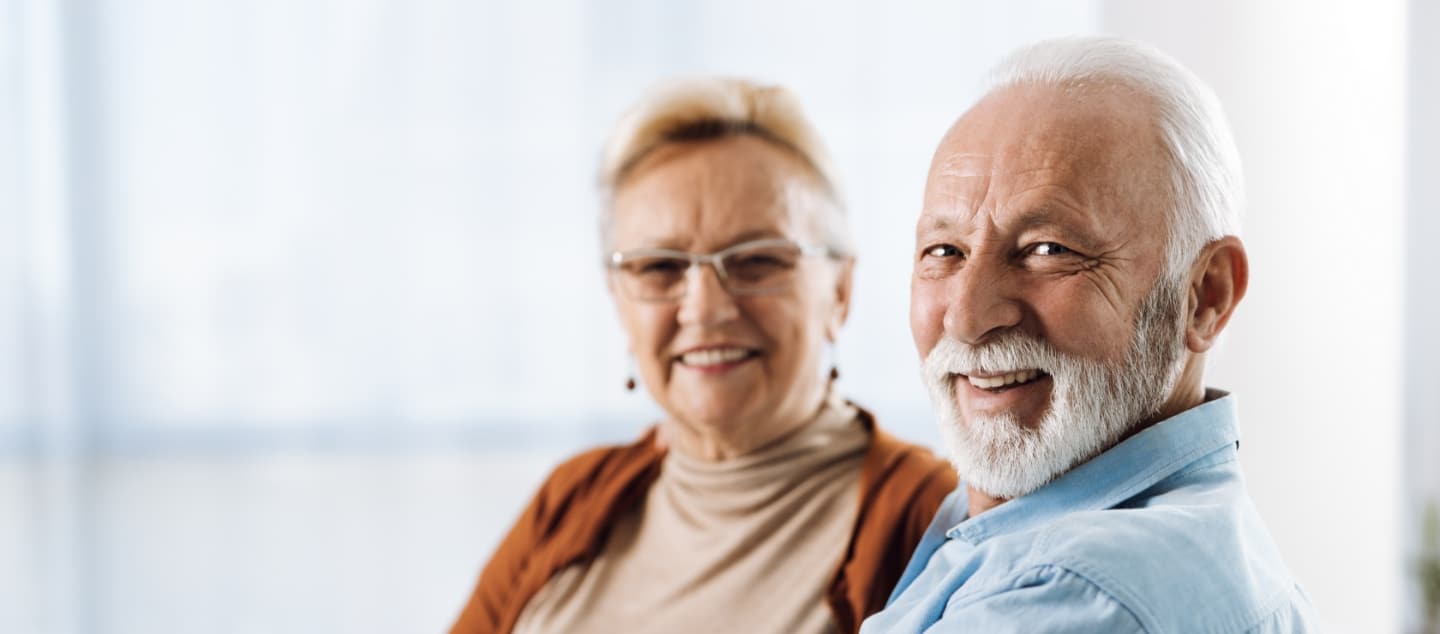 Senior couple with beautiful smiles from treatment at Evergreen Dental in Palmer Alaska.